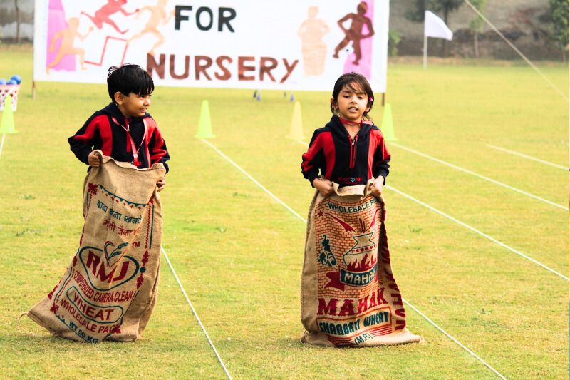 Happy toddlers forming new friendships while playing together at a playgroup in Pataudi