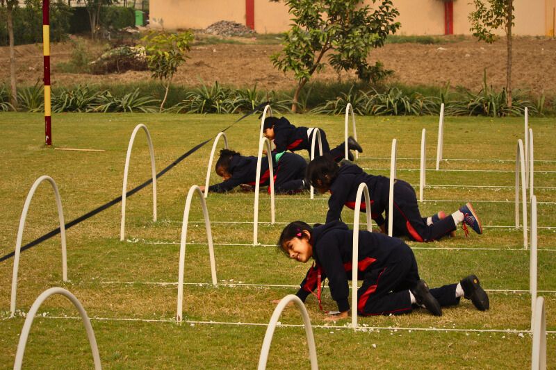 Smiling-children-participating-in-group-activities-at-a-preschool-in-Pataudi